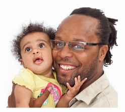 Smiling man holding a baby girl
