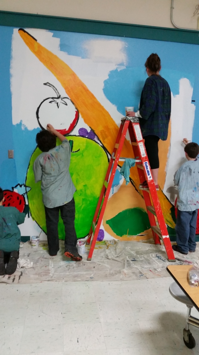 students painting mural