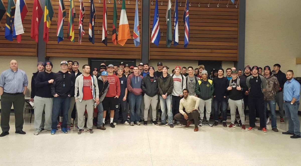 Male athletes from WOU standing in a group 