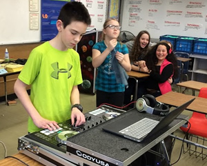 Students learning to run a synthesizer